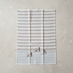 Sparrow tea towel overhead on stone